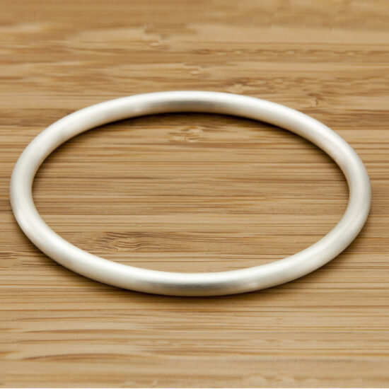 The Eden 5 Heavy Solid Silver Satin Oval Bangle Handmade Chunky Silver Bracelet. London Hallmarked. 5mm