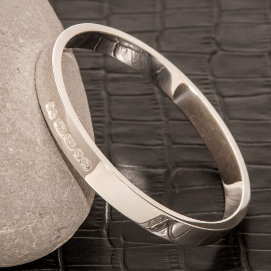 Zennor 8 Chunky Solid Silver Bangle Bracelet, it is Handmade with outside display London Hallmarks - 8mm wide.