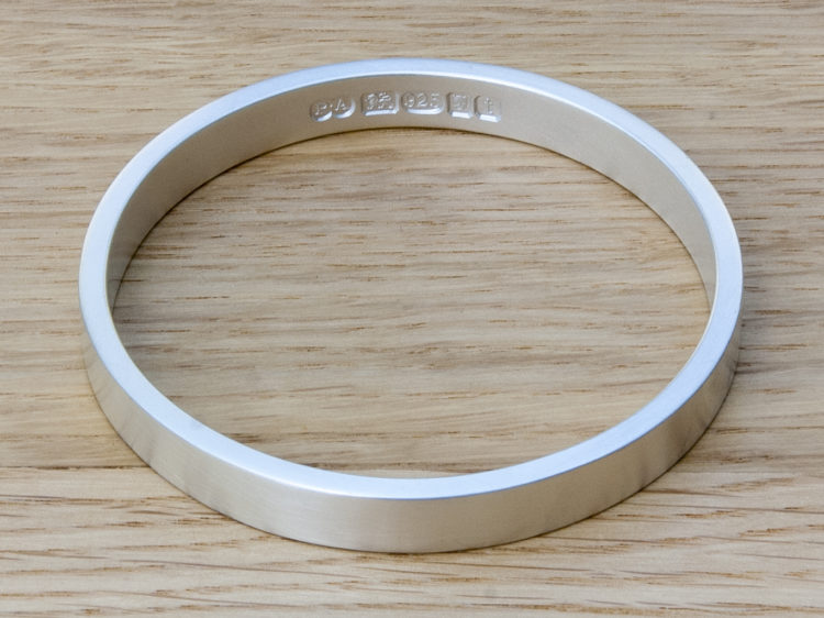 Zennor 8 Chunky Solid Silver Bangle Bracelet, it is Handmade with outside display London Hallmarks - 8mm wide.