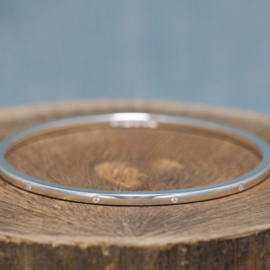 Newlyn 3 Handmade Solid Silver Diamond Bangle. Diamonds set spaced around the sterling silver bracelet