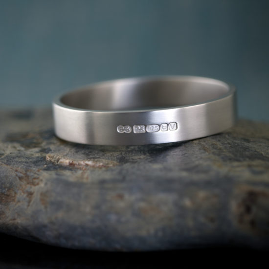 Zennor 12 is an Extra Heavy, Chunky Solid Silver Bangle, Handmade in Cornwall. It is a Solid Silver Bracelet with display London Hallmarks - 12mm wide.