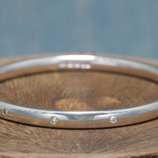 Sennen Handmade Solid Silver Salt and Pepper Diamond Bangle. Salt and Pepper Diamonds set spaced around the sterling silver bracelet